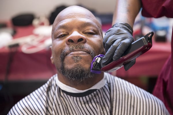 Darryl Byrd receives a trim to his beard during the annual Hosea Helps Thanksgiving dinner at the Georgia World Congress Center in 2017. ALYSSA POINTER/ALYSSA.POINTER@AJC.COM