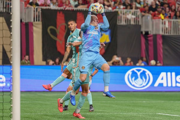 Atlanta United goalkeeper Brad Guzan (1) saves the ball during the first half of an MLS soccer match against Inter Miami, Saturday, Nov. 2, 2024, in Atlanta. (AP Photo/Jason Allen)