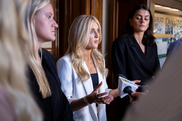 Former collegiate swimmer Riley Gaines, who competed in Georgia but isn’t from the state, speaks to press after testifying in opposition to transgender athletes in women's sports in front of the state senate’s Special Committee on Protecting Women's Sports at the Capitol in Atlanta on Tuesday, August 27, 2024. (Arvin Temkar/AJC)