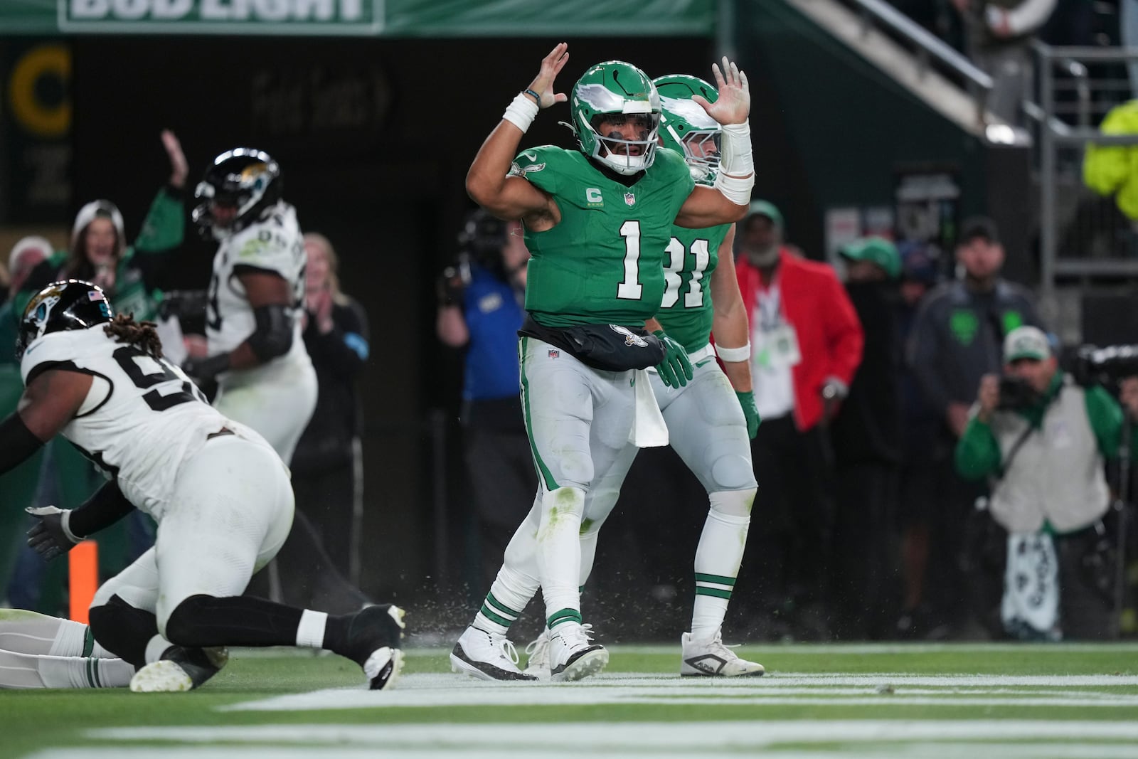 Philadelphia Eagles quarterback Jalen Hurts (1) celebrates scoring a touchdown during the second half of an NFL football game against the Jacksonville Jaguars on Sunday, Nov. 3, 2024, in Philadelphia. (AP Photo/Matt Slocum)