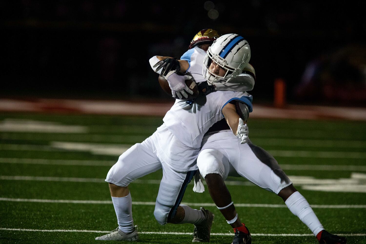 Cambridge wide receiver Ian Chaffin (7) is tackled during a GHSA high school football game between Cambridge High School and Johns Creek High School in Johns Creek, Ga. on Friday, October 15, 2021. (Photo/Jenn Finch)