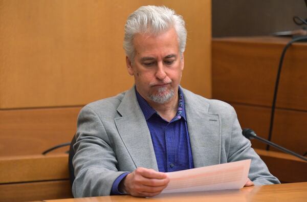 Tom Carter, Dani Jo Carter’s husband, reviews phone records between Tex McIver and himself during Day 7 of the Tex McIver murder trial in Fulton County Superior Court in Atlanta on Wednesday, March 21, 2018. (HYOSUB SHIN / HSHIN@AJC.COM)