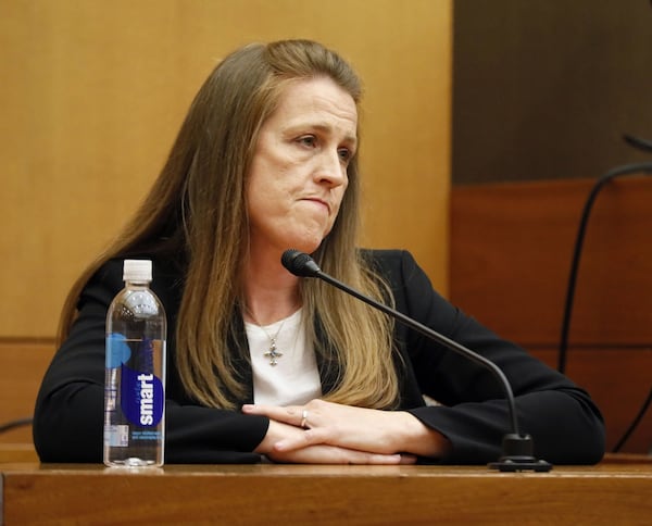 Massage therapist Annie Anderson reacts as she is asked on the stand whether she had a sexual relationship with Tex McIver. The prosecution continually connected Anderson and defendant Tex McIver, hinting at a sexual relationship between the two. Anderson testified for the defense last week that she had never had such a relationship with McIver: “1,000 percent never.” Bob Andres / bandres@ajc.com