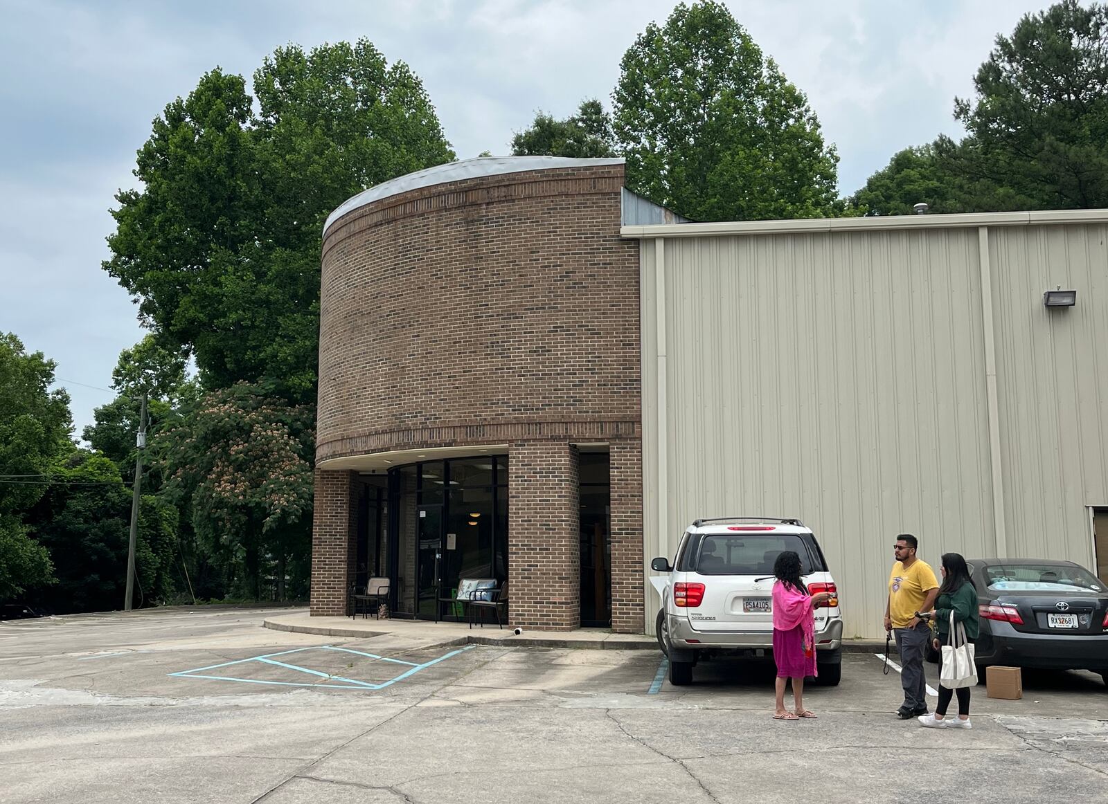 Isis Romero (left) speaks with Giovani Serrano (right) of the Georgia Latino Alliance for Human Rights, after a recent gathering in Canton where he discussed House Bill 1105.