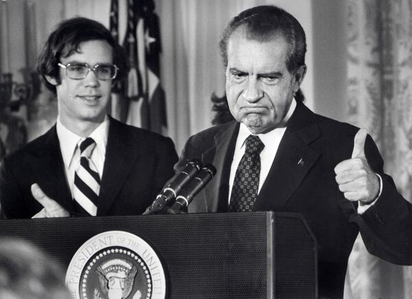 In a photo dated Aug. 9, 1974, U.S. President Richard Nixon bids farewell to the White House staff. At left is his son-in-law David Eisenhower, who was married to his daughter Julie, standing behind Nixon. (Consolidated News Pictures/AFP/Getty Images/TNS)