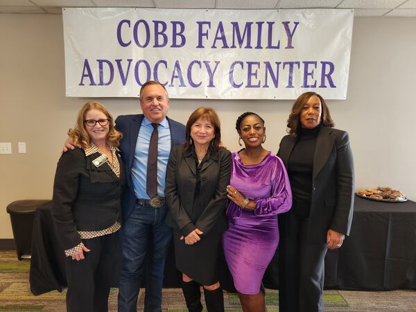 Leaders who helped create the Cobb Family Advocacy Center stand inside the center in Marietta on opening day, Friday, December 15, 2023. Provided by Cobb County.