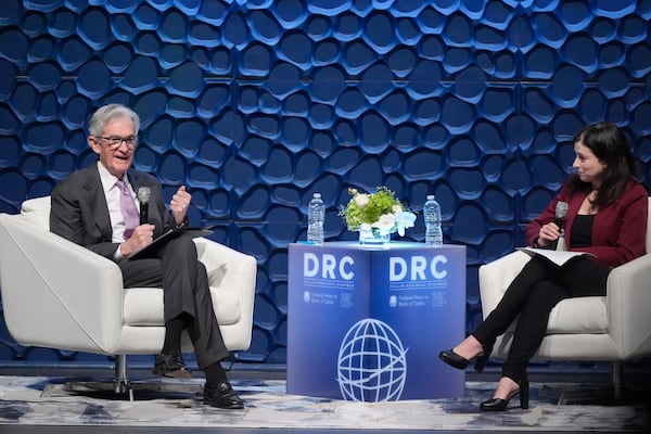 Federal Reserve Chair Jerome Powell, left, speaks to the Dallas Regional Chamber as moderator Catherine Rampell looks during an event in Music Hall at Fair Park Thursday, Nov. 14, 2024, in Dallas. (AP Photo/LM Otero)