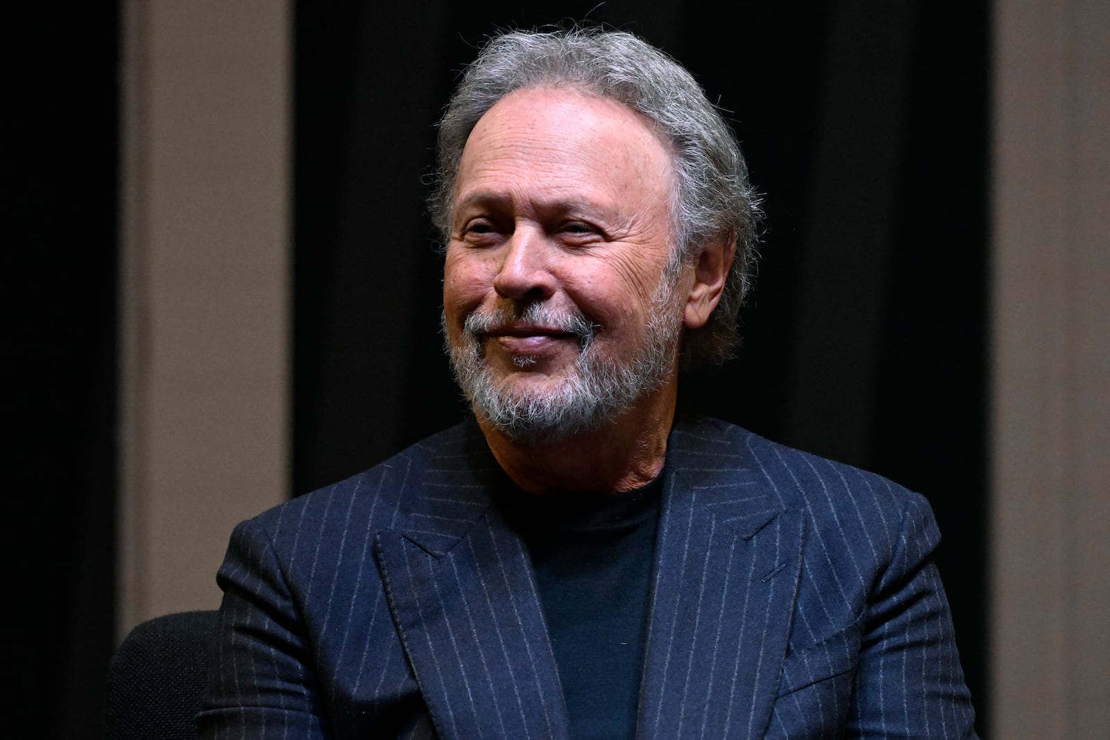 Comedian Billy Crystal attends a ceremony at the Basketball Hall of Fame, Sunday, Oct. 13, 2024, in Springfield, Mass. Crystal, actor Jack Nicholson, film director Spike Lee and businessman Alan Horwitz are being added to the Naismith Memorial Basketball Hall of Fame's James F. Goldstein SuperFan Gallery. (AP Photo/Jessica Hill)