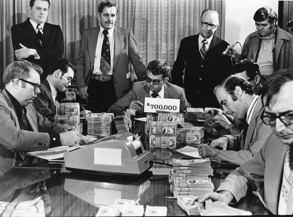 Men counting $700,000 of ransom money for Atlanta Journal Constitution editor Reg Murphy, Atlanta, Georgia, February 23, 1974. The money was placed in two suitcases and it was Journal Editor Jim Minter who was tasked in making the drop. (Bud Skinner)