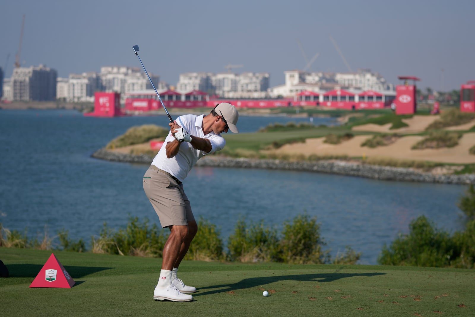 Adam Scott of Australia tees off at 12th hole during the second round of Abu Dhabi Golf Championship in Abu Dhabi, United Arab Emirates, Friday, Nov. 8, 2024. (AP Photo/Altaf Qadri)