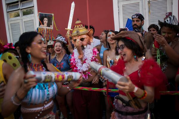 A reveler dressed as Ganesha, a Hindu deity, center, watches the "Ceu na Terra" or "Heaven on Earth" Carnival street party in Rio de Janeiro, Saturday, March 1, 2025. (AP Photo/Bruna Prado)