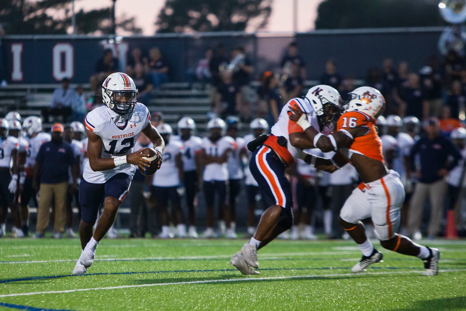 Damien Dee, quarterback for Northside, scrambles in the pocket during the North Cobb vs. Northside high school football game on Friday, September 16, 2022, in Kennesaw, Georgia. North Cobb led Northside 14-7 at the half. CHRISTINA MATACOTTA FOR THE ATLANTA JOURNAL-CONSTITUTION.