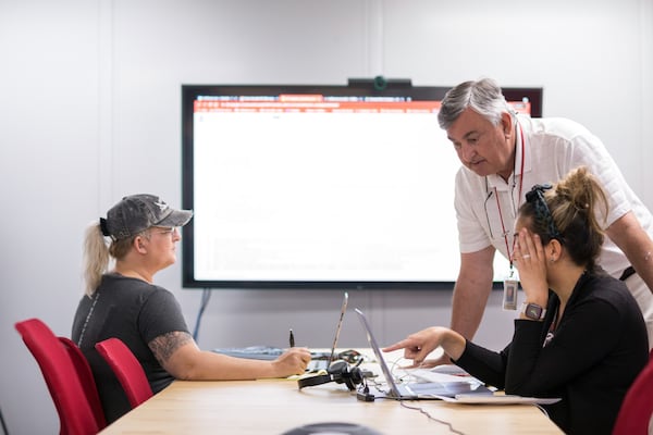 SAVANNAH, GA - JUNE 04, 2021: Bob Bilbrough, the Chief Operations Officer for Fulfillment.com in Savannah, standing right, goes over an order with his team at the facility. (AJC Photo/Stephen B. Morton)