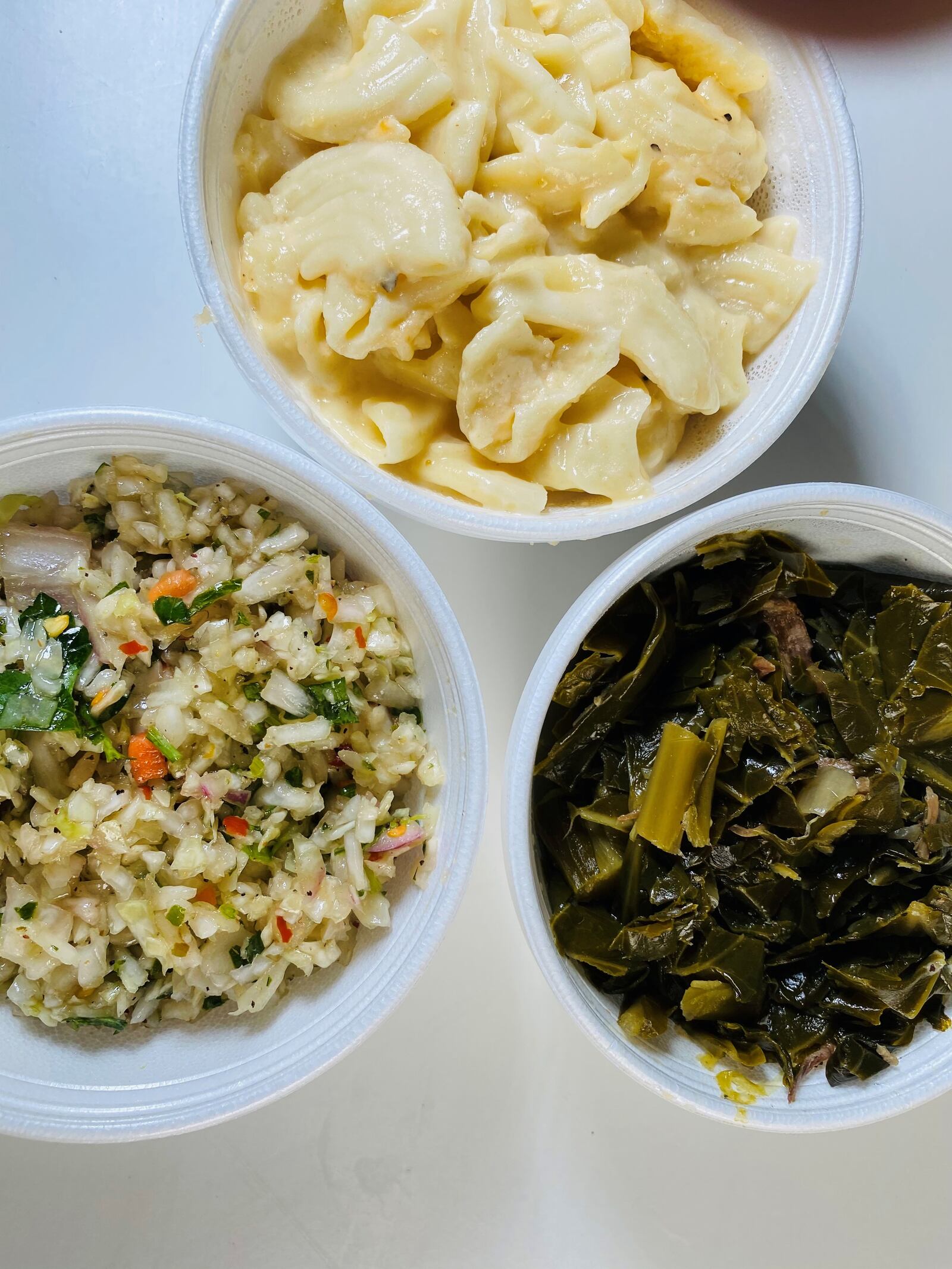 Sides at Ford’s BBQ include vinegar slaw, mac and queso and collard greens. Bob Townsend for The Atlanta Journal-Constitution
