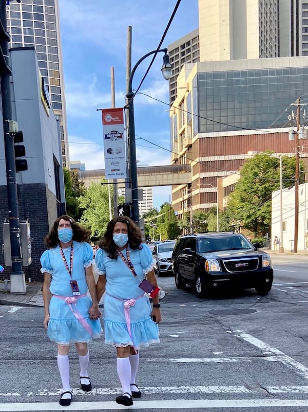 Matching masks only add to the ominous vibe of these Dragon Con revelers, costumed as the twins from “The Shining.” ALEXIS HAUK / ARTSATL