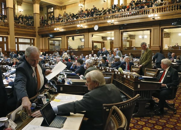 State Rep. Chuck Martin (left), an Alpharetta Republican, during the vote on a bill to allow smaller government pensions to invest in mutual funds. BOB ANDRES / AJC 2015 file photo