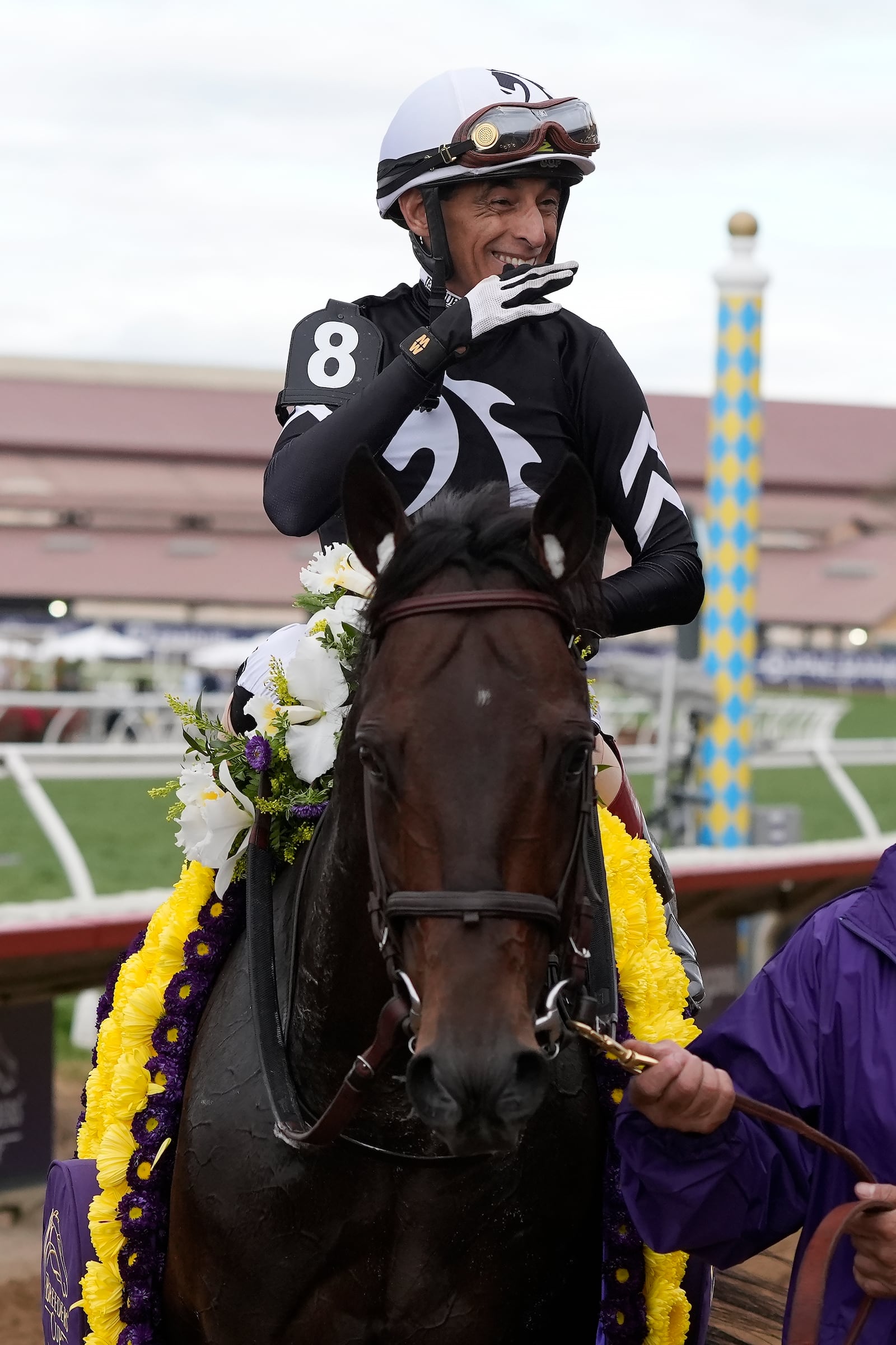 John Velazquez, top, celebrates after riding Straight No Chaser to victory in the Breeders' Cup Sprint horse race in Del Mar, Calif., Saturday, Nov. 2, 2024. (AP Photo/Gregory Bull)