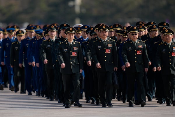 Chinese military delegates attend a pre-session on the eve of the opening of the National People's Congress at the Great Hall of the People in Beijing, Tuesday, March 4, 2025. (AP Photo/Ng Han Guan)