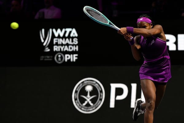 Coco Gauff of the U.S. plays a shot against China's Qinwen Zheng during their women's singles final match of the WTA finals at the King Saud University Indoor Arena, in Riyadh, Saudi Arabia, Saturday, Nov. 9, 2024. (AP Photo)