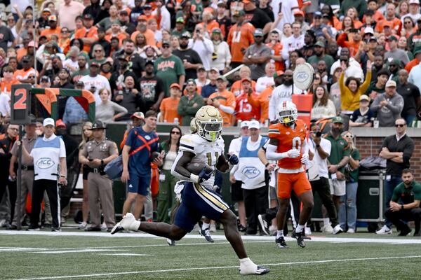 Georgia Tech running back Jamal Haynes (11) scores a touchdown to cap the Yellow Jackets' first series Saturday against Miami. Hyosub Shin/AJC