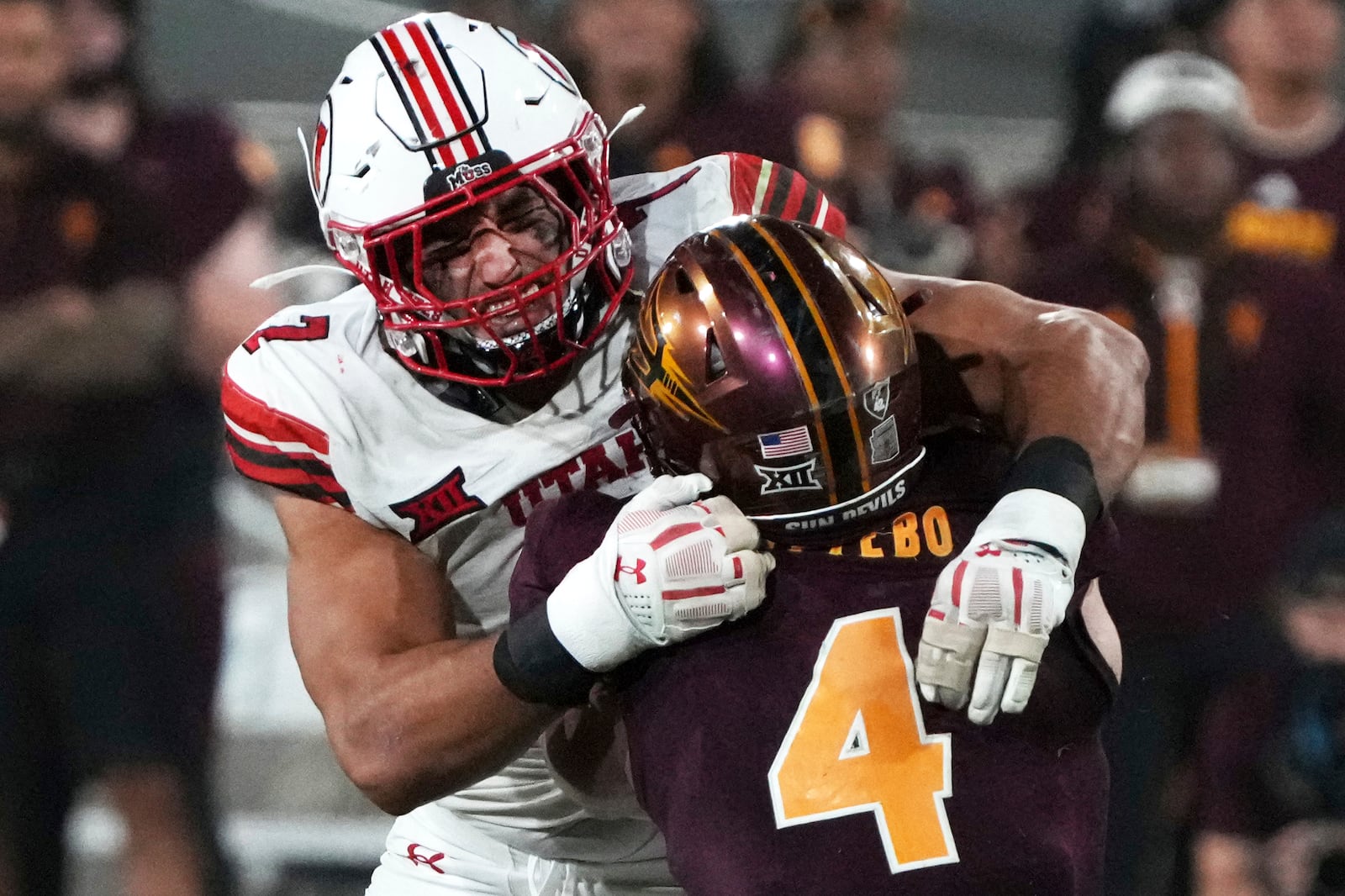 Utah defensive end Van Fillinger tackles Arizona State running back Cam Skattebo (4) in the second half during an NCAA college football game, Friday, Oct. 11, 2024, in Tempe, Ariz. Arizona State won 27-19. (AP Photo/Rick Scuteri)