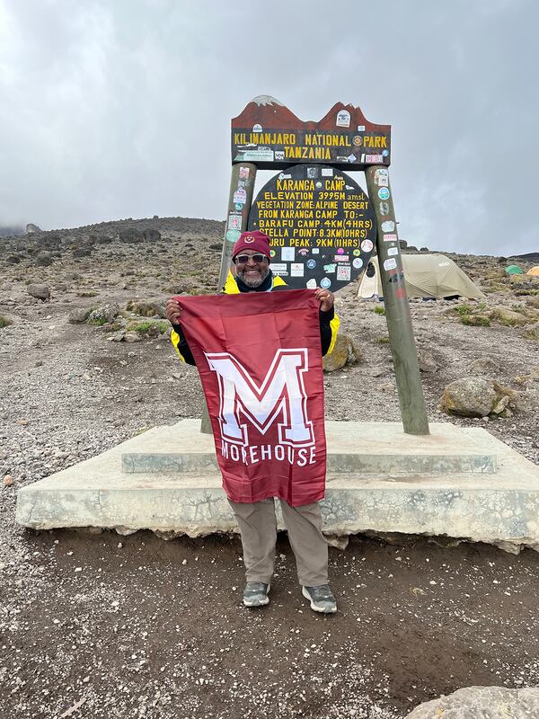 Georgia businessman C. David Moody Jr. proudly displays the Morehouse logo while on his hike up Mount Kilimanjaro. (Contributed by C. David Moody)