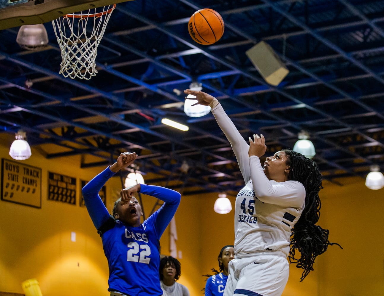 Taylor Christmas (45), center for South Dekalb High School, shoots over a block by Justice Bennett (22), center for Cass High School, during the South Dekalb vs. Cass girls basketball playoff game on Friday, February 26, 2021, at South Dekalb High School in Decatur, Georgia. South Dekalb defeated Cass 72-46. CHRISTINA MATACOTTA FOR THE ATLANTA JOURNAL-CONSTITUTION