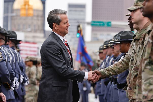 Gov. Brian Kemp reviews troops following his inauguration Jan. 12 at the Georgia State University Convocation Center. (Natrice Miller/natrice.miller@ajc.com) 