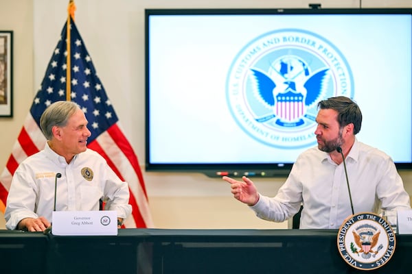 Vice President JD Vance talks with Texas Gov. Greg Abbott at the Border Patrol Station South during a visit to the U.S. border with Mexico Wednesday, March 5, 2025 in Eagle Pass, Texas. (Brandon Bell/Pool via AP)