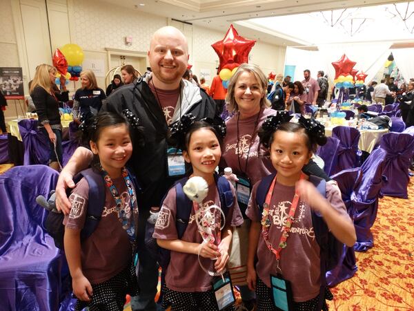 Brandon and Trish Schulte of Greenville, S.C. with their three adopted girls (l-r) Haley, Hannah and Taylor. CREDIT: Rodney Ho/rho@ajc.com