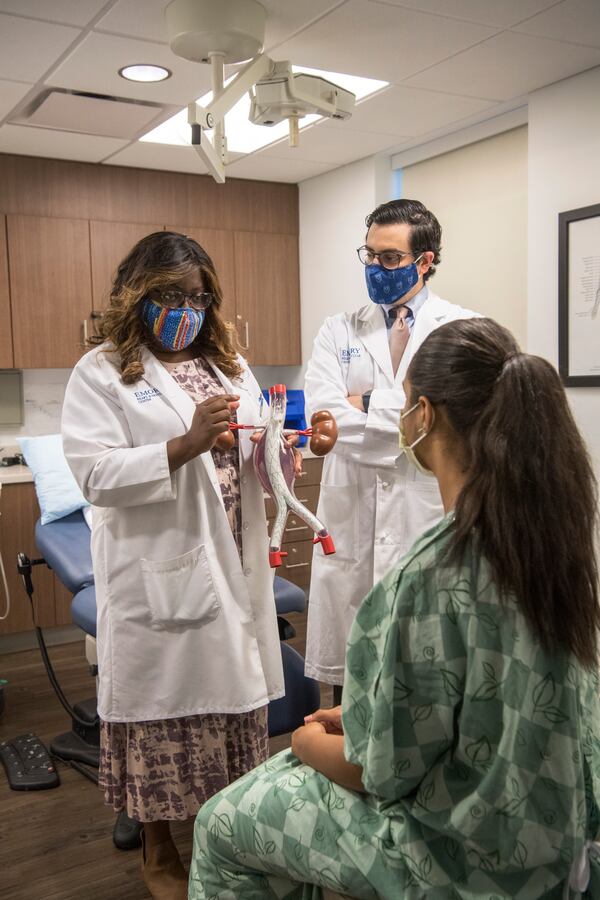 Dr. Olamide Alabi demonstrates how she performs complex endovascular aortic aneurysm repairs with fenestrated endografts – which is not part of treatment for PAD specifically, but part of her vascular medicine practice. Also with the patient is vascular surgery resident Dr. Anthony Meena. 
Provided by Emory Healthcare