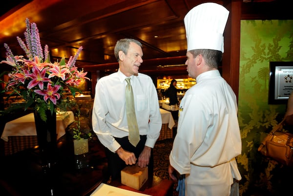  Server Richard Flint, left, and Stephen Lewis, a month before the Dining Room's final service. AJC file photo: Hyosub Shin