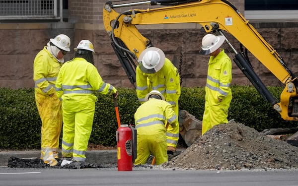 Crews work on a gas leak Thursday on Howell Mill Road in front of the Piedmont West medical office. Feb. 27, 2025.