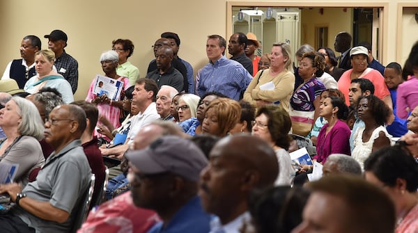 Hundreds of DeKalb County residents filled the Maloof Auditorium to a standing-room-only capacity Thursday night, seeking answers to high water bills. BRANT SANDERLIN/BSANDERLIN@AJC.COM