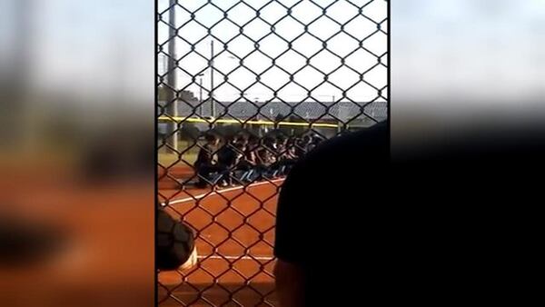 The Cedar Grove High School softball team took a knee during the national anthem. (Credit: Channel 2 Action News)