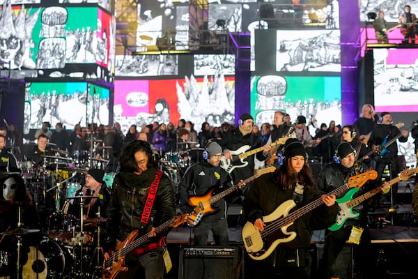 Musicians play on the stage during the concert for freedom for the 35th anniversary of the fall of the Berlin Wall, at the Brandenburg Gate in Berlin, Germany, Saturday, Nov. 9, 2024. (AP Photo/Ebrahim Noroozi)