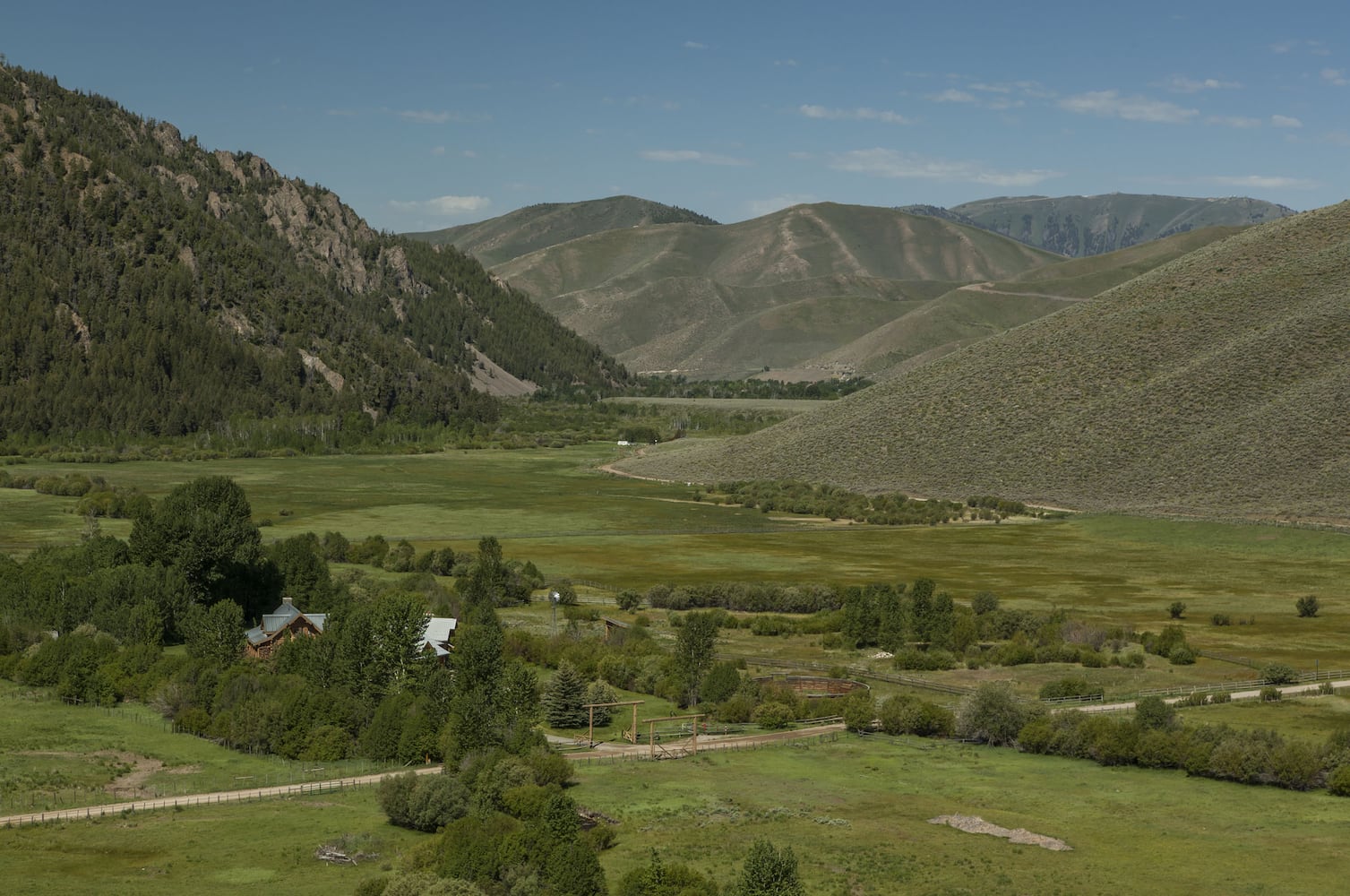 500-acre property has log cabins, mountain views