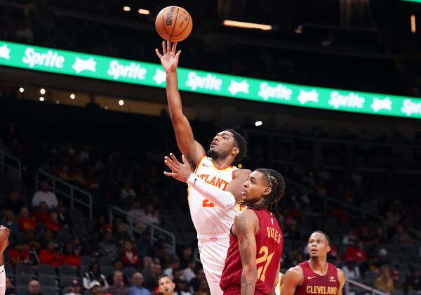 Atlanta Hawks guard Trent Forrest (2) attempts a shot against Cleveland Cavaliers forward Emoni Bates (21) during the second half of a NBA preseason game at State Farm Arena, Tuesday, October 10, 2023, in Atlanta. The Hawks won 108-107. (Jason Getz / Jason.Getz@ajc.com)