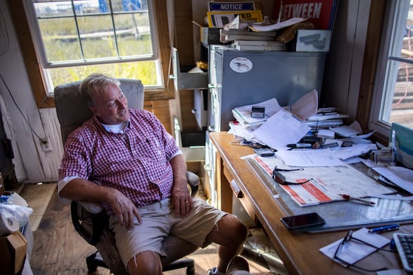 TYBEE ISLAND, GA - OCTOBER 4, 2023: Pat Mathews plans his day in his small office, Wednesday, Oct. 4, 2023, in Tybee Island, Georgia. Shrimpers and packing houses such as MathewÕs Packaging are struggling with foreign farm raised shrimp in the market. (AJC Photo/Stephen B. Morton)