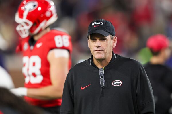 Georgia offensive coordinator Mike Bobo watches warm-ups before Georgia’s game against Georgia Tech at Bobby Dodd Stadium, Saturday, November 25, 2023, in Atlanta. (Jason Getz / Jason.Getz@ajc.com)