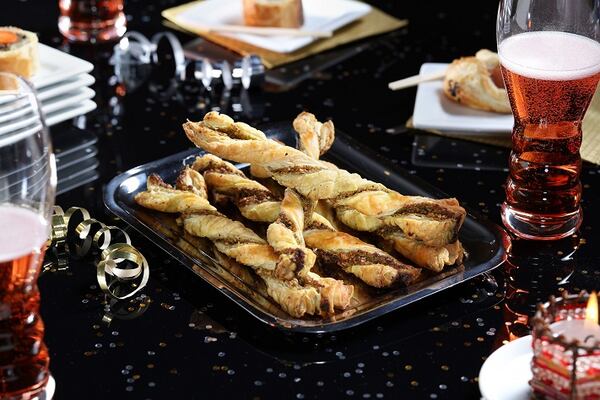 Basil pesto and ground pistachios flavor crispy twists made from puff pastry., on Tuesday Dec., 12, 2017. (Abel Uribe/Chicago Tribune/TNS)