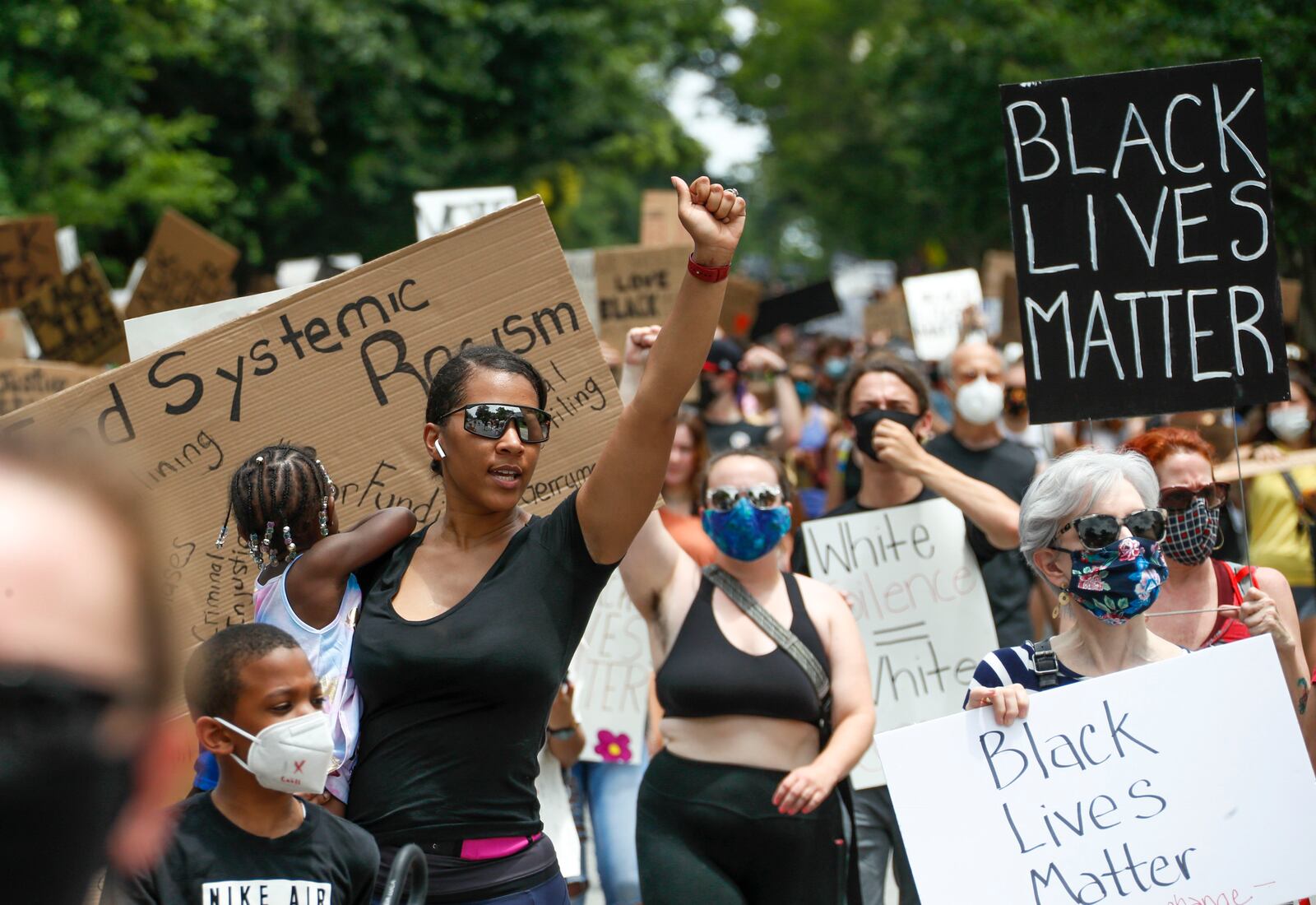 On a day that would have been the start of Summerfest, canceled due to the pandemic, about 1,000 protesters gathered at the corner of Virginia and North Highland avenues and marched down Virginia Avenue to Piedmont Park, where they planned to join with other protest groups and march downtown. (Photo: Bob Andres / bandres@ajc.com)