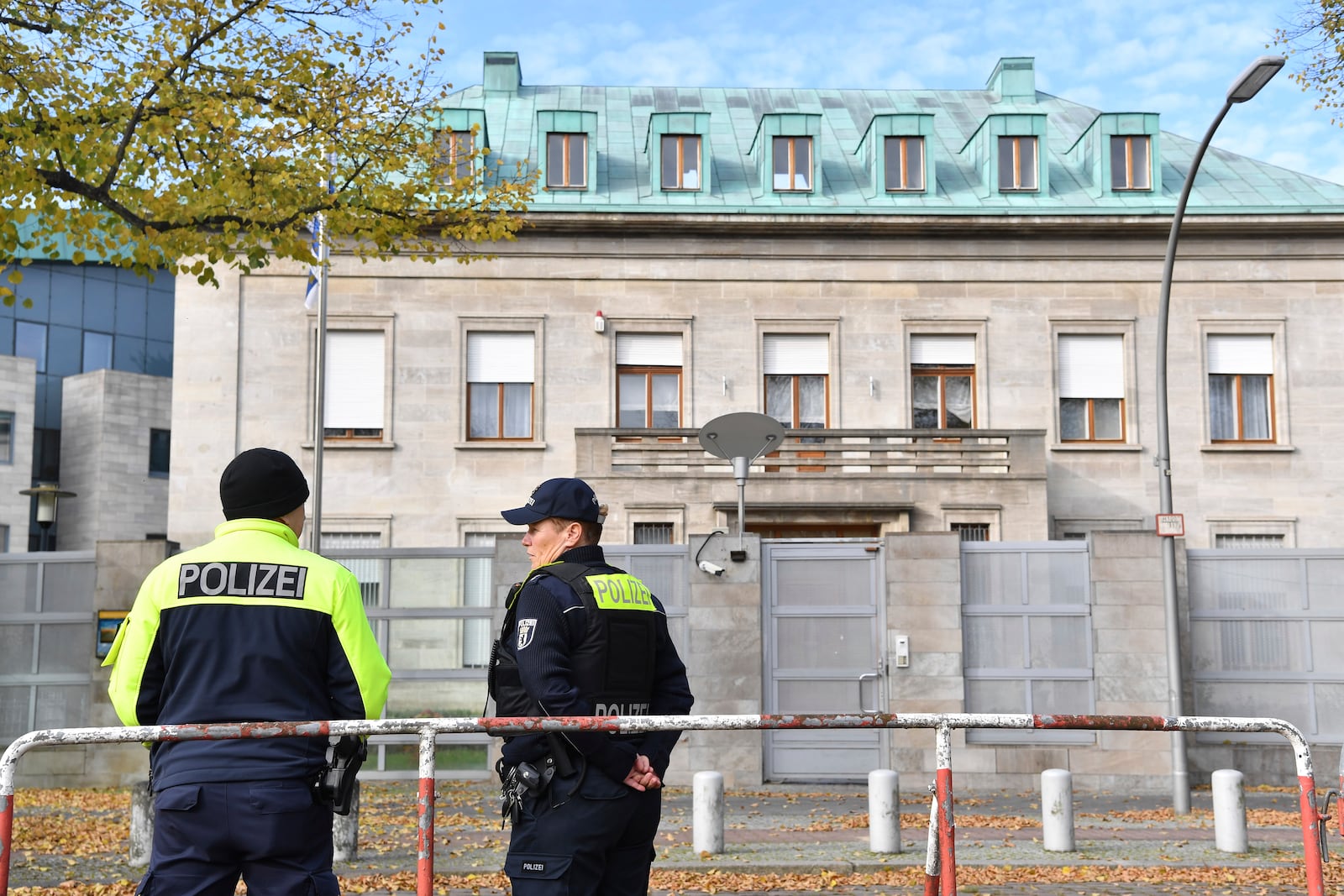 Police officers stand by the Israeli embassy in Berlin, Sunday, Oct. 20, 2024. (Paul Zinken/dpa via AP)