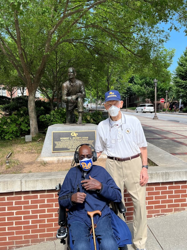 Bobby Grier (seated) and Wade Mitchell met in front of the Bobby Dodd statue on the Georgia Tech campus when Grier took a tour of the Tech campus in June. Grier played football at the University of Pittsburgh and Mitchell at Tech. Their teams met in the 1956 Sugar Bowl, a game known as a significant one in the history of segregation in the South. Grier played fullback for Pitt, and Mitchell was Tech's quarterback. The legendary Dodd was Tech’s coach from 1945-66. (Photo courtesy of Wright Mitchell)