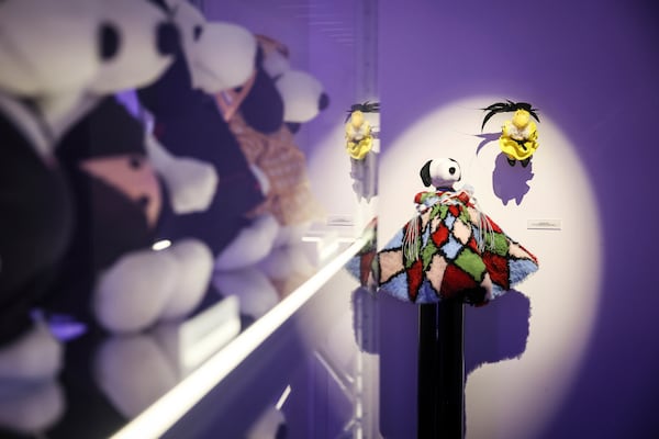 Figurines representing Snoopy wear creations as part of Peanuts' 75th Anniversary, at the Snoopy In Style exhibition that runs from March 22 through April 5, in Paris Thursday, March 20, 2025. (AP Photo/Thomas Padilla)