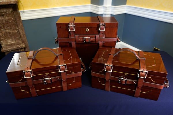 The mahogany boxes that will hold the electoral votes are on display on Capitol Hill, Thursday, Dec. 19, 2024, in Washington. (AP Photo/Yuri Gripas)