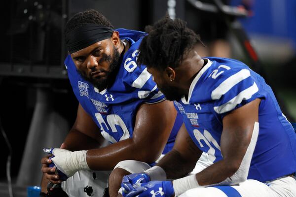 Georgia State Panthers center Malik Sumter (62) talks with running back Jamyest Williams (21) during the closing minutes of their loss to the Coastal Carolina Chanticleers at Center Parc Stadium, Thursday, September 22, 2022, in Atlanta. Coastal Carolina won 41-24. (Jason Getz / Jason.Getz@ajc.com)