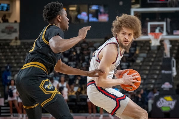 Jackson State forward Romelle Mansel, right, defends against an Alabama State player during the first half of an NCAA basketball game in the championship of the Southwest Athletic Conference Championship tournament Saturday, March 15, 2025, in College Park, Ga. (AP Photo/Erik Rank)