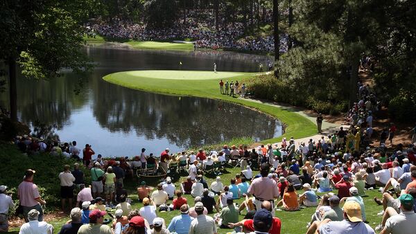 Patrons watch Gary Player on the 8th green during the Par 3 contest  Wednesday, April 4, 2007, at Augusta National Golf Club in Augusta.