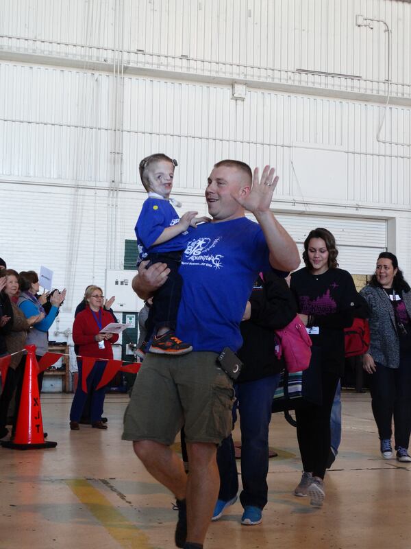 Hunter on the red carpet send-off at the hangar. CREDIT: Rodney Ho/ rho@ajc.com